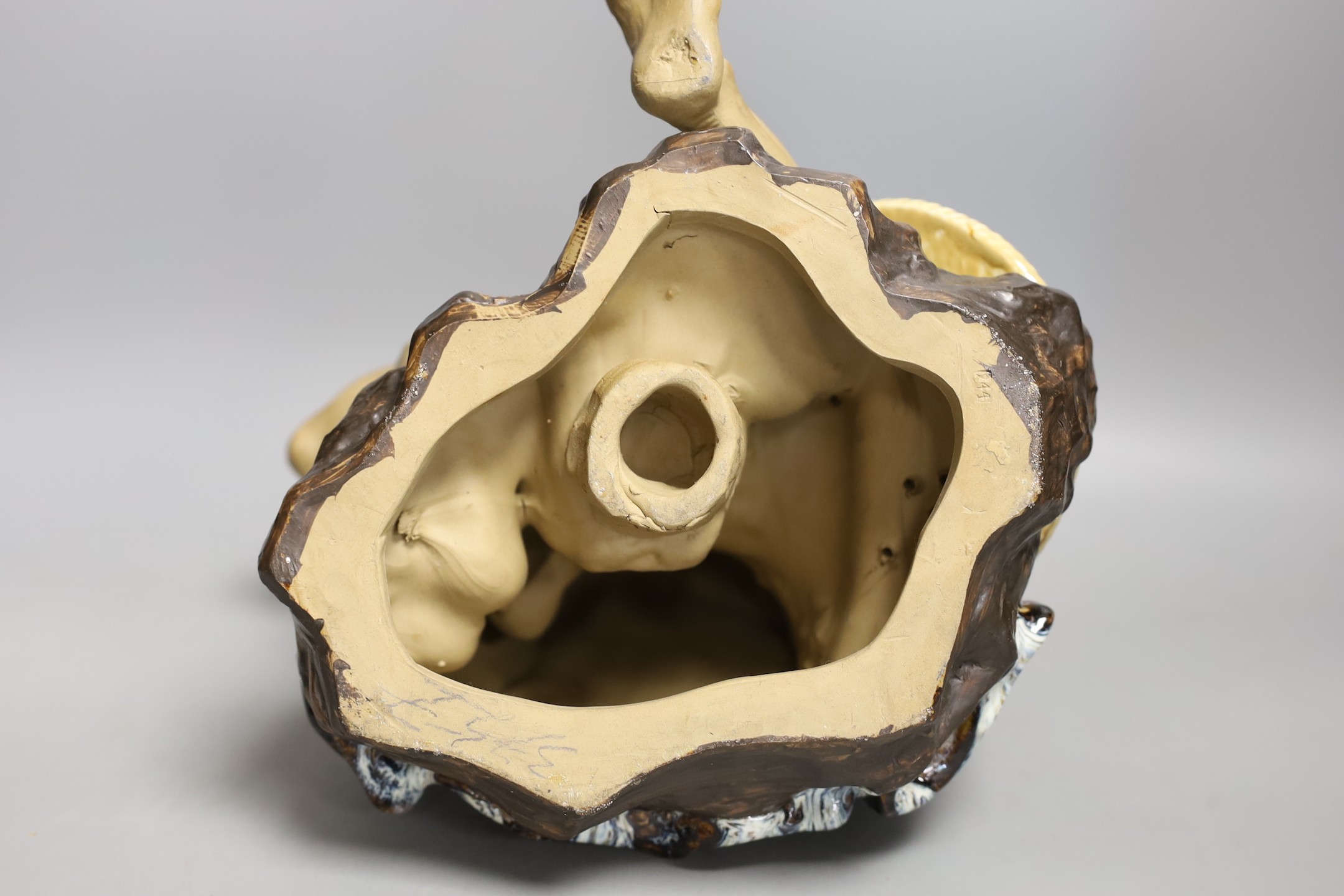A large Chinese Shiwan pottery figure of seated monk, 25cm